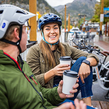 Couple enjoying coffee together on bike ride