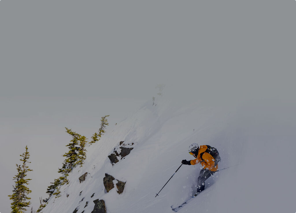 skier going down steep mountain